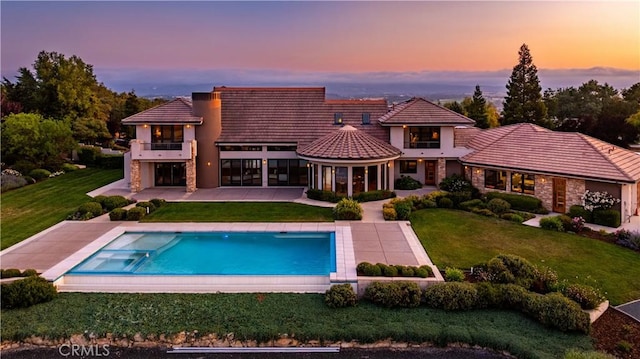 2340 Battering Rock Rd, Templeton, CA 93465 - back of house with a balcony, a lawn, a patio area, an outdoor pool, and a tiled roof