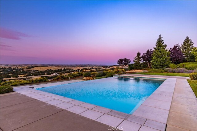 2340 Battering Rock Rd, Templeton, CA 93465 - pool at dusk featuring an outdoor pool and a patio area