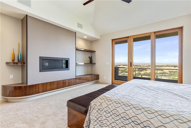 2340 Battering Rock Rd, Templeton, CA 93465 - carpeted bedroom featuring access to exterior, multiple windows, baseboards, vaulted ceiling, and a tiled fireplace