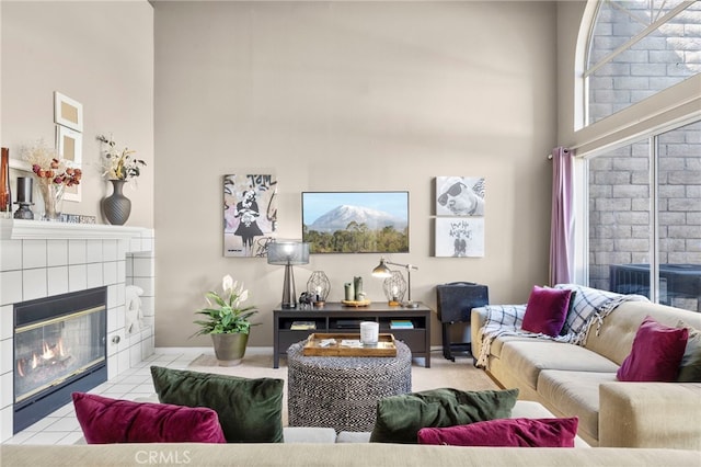 999 Alleghany Cir, San Dimas, CA 91773 - living area featuring a high ceiling, a tiled fireplace, and baseboards