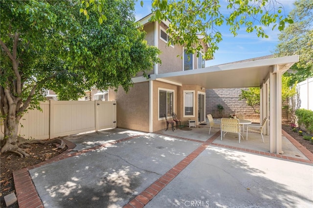 999 Alleghany Cir, San Dimas, CA 91773 - rear view of house with stucco siding, a patio area, and outdoor dining area