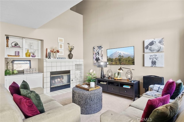 999 Alleghany Cir, San Dimas, CA 91773 - living area with carpet, a tile fireplace, and high vaulted ceiling