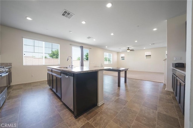 1172 Poinsettia Cir, Calimesa, CA 92320 - kitchen featuring stainless steel dishwasher, recessed lighting, a glass covered fireplace, a kitchen island with sink, and ceiling fan