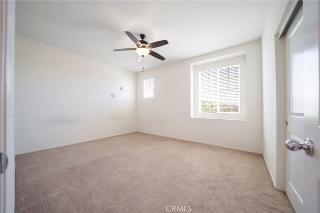 1172 Poinsettia Cir, Calimesa, CA 92320 - spare room featuring light carpet and ceiling fan