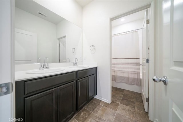 1172 Poinsettia Cir, Calimesa, CA 92320 - full bath featuring double vanity and stone finish flooring