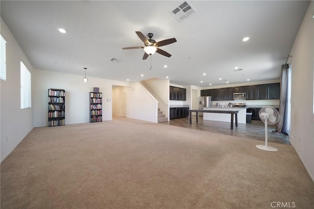 1172 Poinsettia Cir, Calimesa, CA 92320 - unfurnished living room with carpet flooring, recessed lighting, ceiling fan, and stairway