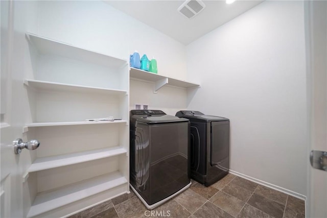 1172 Poinsettia Cir, Calimesa, CA 92320 - laundry area with washing machine and dryer and dark stone finish floors