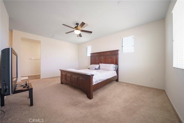 1172 Poinsettia Cir, Calimesa, CA 92320 - bedroom featuring light carpet, multiple windows, and ceiling fan