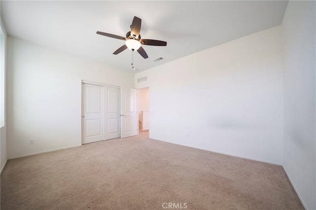 1172 Poinsettia Cir, Calimesa, CA 92320 - unfurnished bedroom featuring carpet floors, a closet, and a ceiling fan