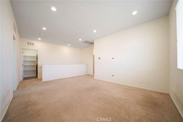 1172 Poinsettia Cir, Calimesa, CA 92320 - spare room featuring light carpet and recessed lighting