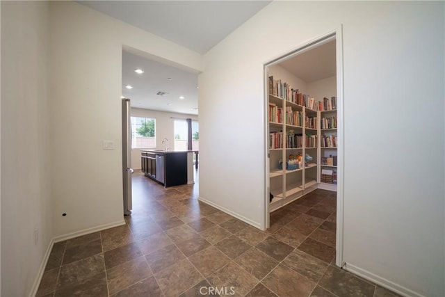 1172 Poinsettia Cir, Calimesa, CA 92320 - corridor featuring a sink and recessed lighting