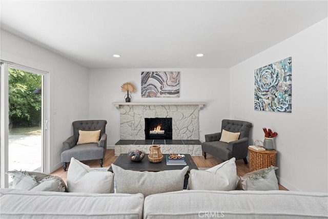 2225 Cartlen Dr, Placentia, CA 92870 - living area with a stone fireplace, wood finished floors, recessed lighting, and baseboards
