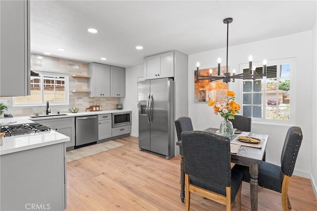 2225 Cartlen Dr, Placentia, CA 92870 - kitchen featuring appliances with stainless steel finishes, a sink, gray cabinets, backsplash, and recessed lighting