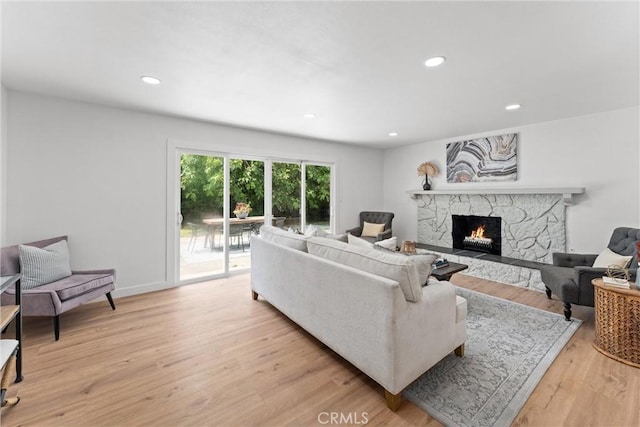 2225 Cartlen Dr, Placentia, CA 92870 - living area featuring a fireplace, light wood-style flooring, recessed lighting, and baseboards