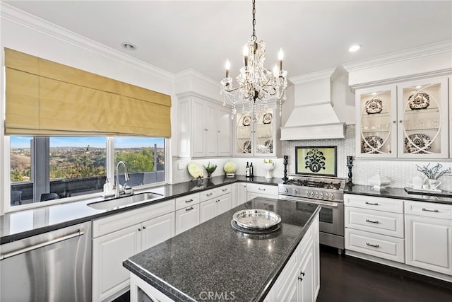24 Lyon Rdg, Aliso Viejo, CA 92656 - kitchen with appliances with stainless steel finishes, premium range hood, white cabinetry, decorative backsplash, and ornamental molding