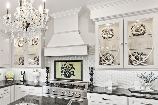 24 Lyon Rdg, Aliso Viejo, CA 92656 - kitchen with high end stainless steel range, tasteful backsplash, glass insert cabinets, a chandelier, and crown molding