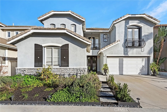 24 Lyon Rdg, Aliso Viejo, CA 92656 - mediterranean / spanish home with a balcony, french doors, an attached garage, a tile roof, and stucco siding