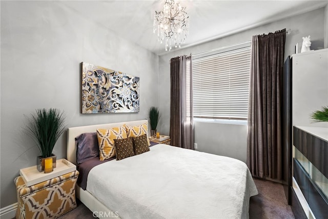 24 Lyon Rdg, Aliso Viejo, CA 92656 - bedroom with dark colored carpet and a chandelier