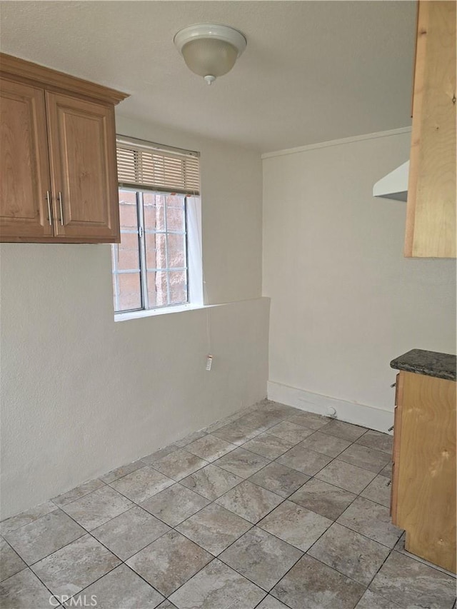 1126 S Dacotah St, Los Angeles, CA 90023 - unfurnished dining area featuring baseboards
