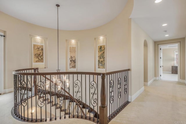 6286 Belmont Trail Ct, San Diego, CA 92130 - hall featuring an upstairs landing, carpet floors, baseboards, arched walkways, and recessed lighting
