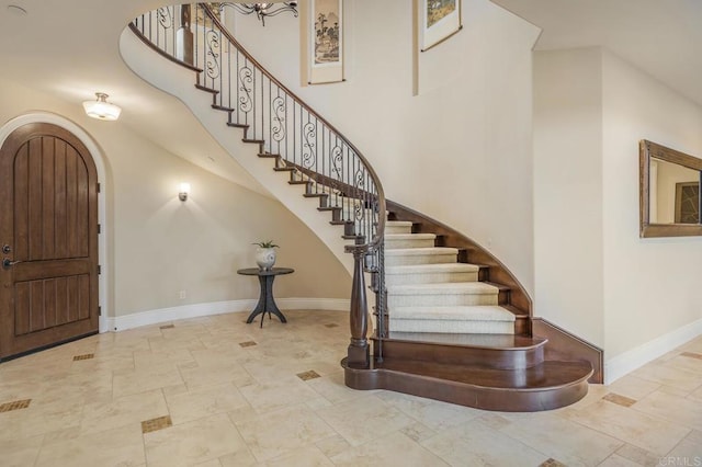 6286 Belmont Trail Ct, San Diego, CA 92130 - entrance foyer with baseboards, stairs, arched walkways, and a high ceiling