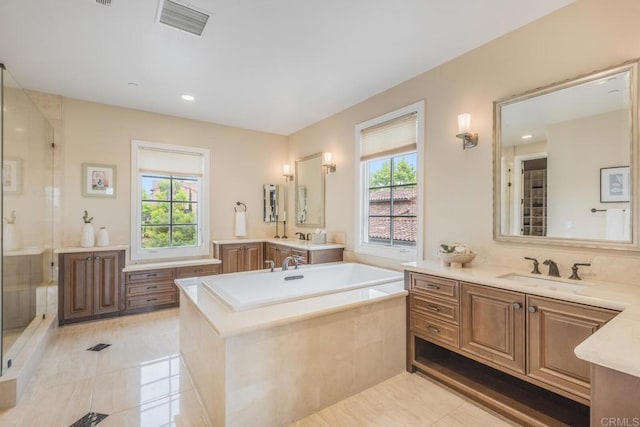 6286 Belmont Trail Ct, San Diego, CA 92130 - bathroom with healthy amount of natural light, a shower stall, two vanities, a bath, and recessed lighting