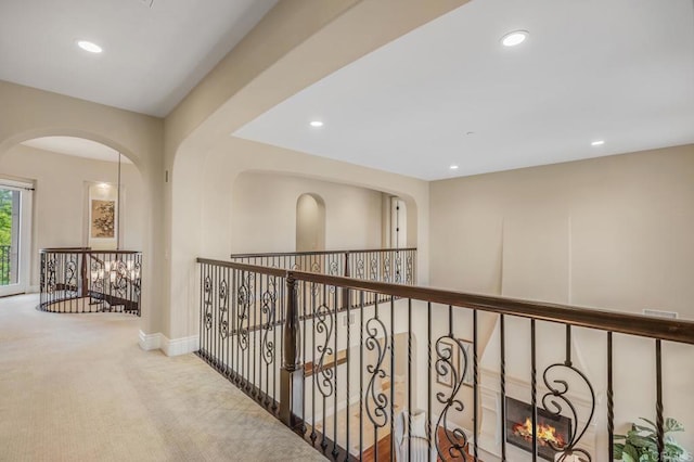 6286 Belmont Trail Ct, San Diego, CA 92130 - hallway featuring carpet flooring, recessed lighting, arched walkways, and baseboards