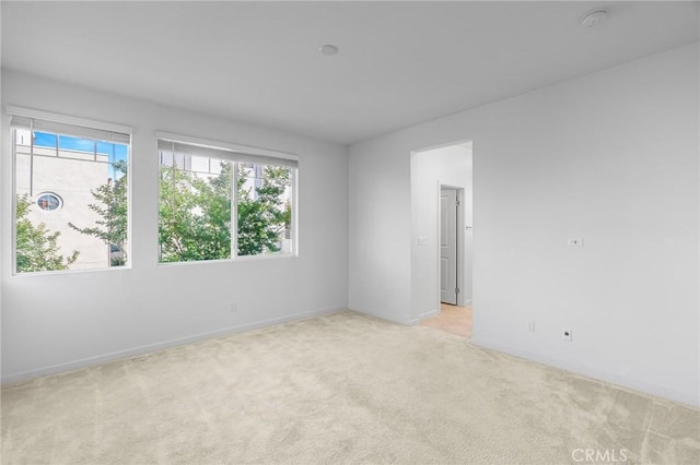 148 Stage, Irvine, CA 92618 - empty room with light colored carpet, baseboards, and a smoke detector