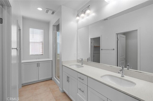 148 Stage, Irvine, CA 92618 - bathroom with tile patterned flooring, double vanity, recessed lighting, and an enclosed shower