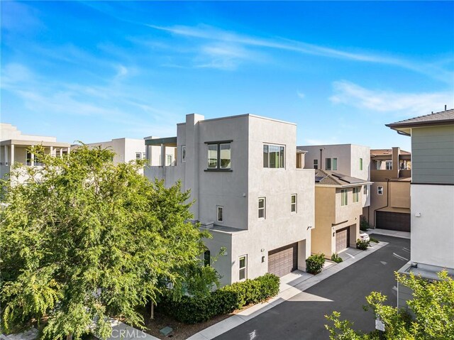 148 Stage, Irvine, CA 92618 - view of property with an attached garage and a residential view