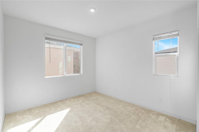 148 Stage, Irvine, CA 92618 - spare room with plenty of natural light, carpet flooring, baseboards, and recessed lighting