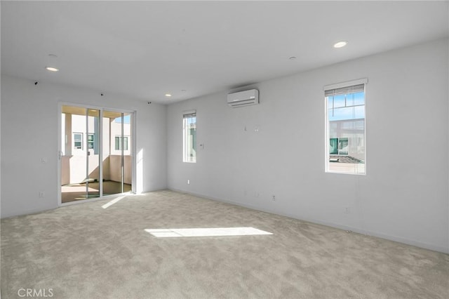 148 Stage, Irvine, CA 92618 - empty room featuring a wall mounted AC, healthy amount of natural light, carpet, and recessed lighting