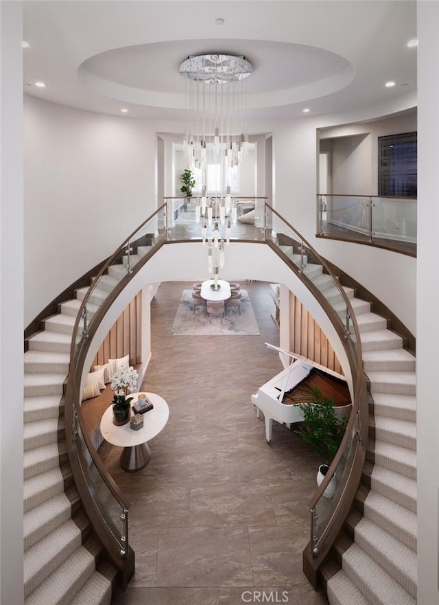 112 Mountain Sky, Irvine, CA 92602 - staircase featuring a tray ceiling, recessed lighting, and a chandelier