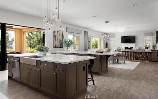 112 Mountain Sky, Irvine, CA 92602 - kitchen with a large island, dishwasher, a kitchen bar, open floor plan, and decorative light fixtures