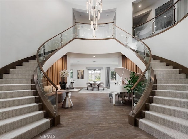 112 Mountain Sky, Irvine, CA 92602 - stairs featuring a high ceiling and a chandelier
