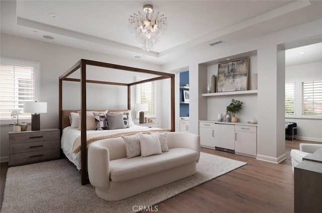 112 Mountain Sky, Irvine, CA 92602 - bedroom featuring light wood finished floors, a raised ceiling, a chandelier, and recessed lighting