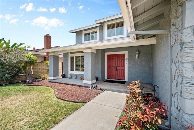 10586 Ring Ave, Rancho Cucamonga, CA 91737 - property entrance featuring stucco siding, a porch, and a yard