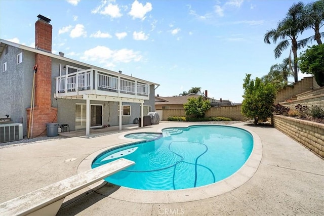 10586 Ring Ave, Rancho Cucamonga, CA 91737 - view of swimming pool with a fenced backyard, a patio, a diving board, and a pool with connected hot tub