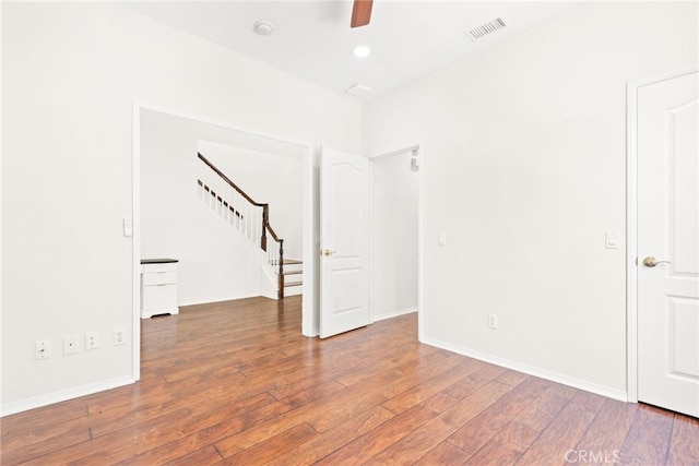 8180 E Brookdale Ln, Anaheim Hills, CA 92807 - empty room with stairway, wood-type flooring, ceiling fan, baseboards, and recessed lighting