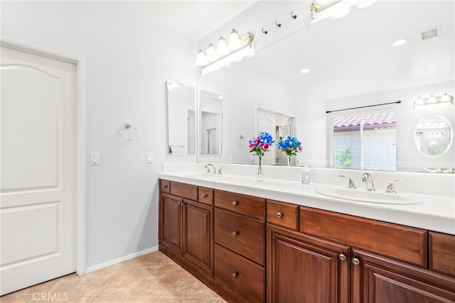 8180 E Brookdale Ln, Anaheim Hills, CA 92807 - full bathroom with double vanity, tile patterned flooring, and baseboards
