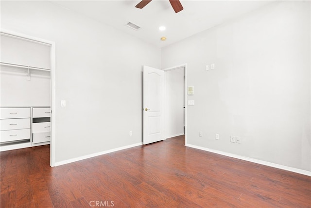 8180 E Brookdale Ln, Anaheim Hills, CA 92807 - unfurnished bedroom featuring a spacious closet, wood finished floors, and baseboards