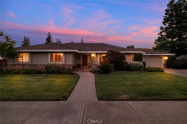 833 Saint Amant Dr, Chico, CA 95926 - ranch-style home featuring concrete driveway, a lawn, and a garage
