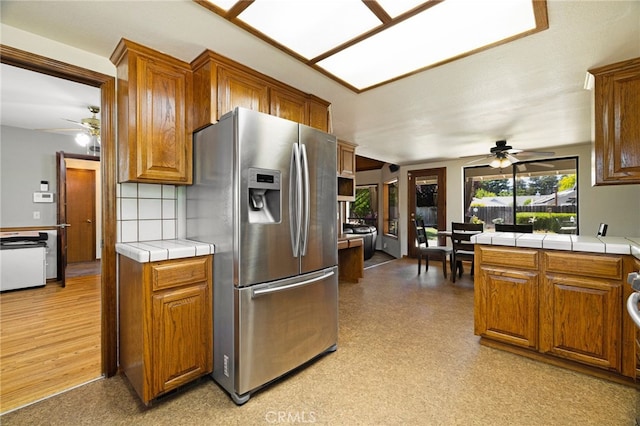 833 Saint Amant Dr, Chico, CA 95926 - kitchen with stainless steel refrigerator with ice dispenser, ceiling fan, and tile countertops
