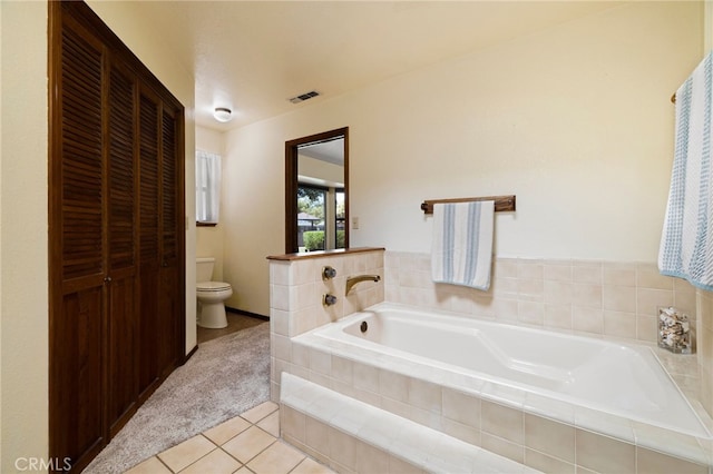 833 Saint Amant Dr, Chico, CA 95926 - full bath with tile patterned flooring, a garden tub, and a closet