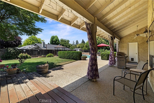 833 Saint Amant Dr, Chico, CA 95926 - fenced backyard with a wooden deck, a ceiling fan, and a grill