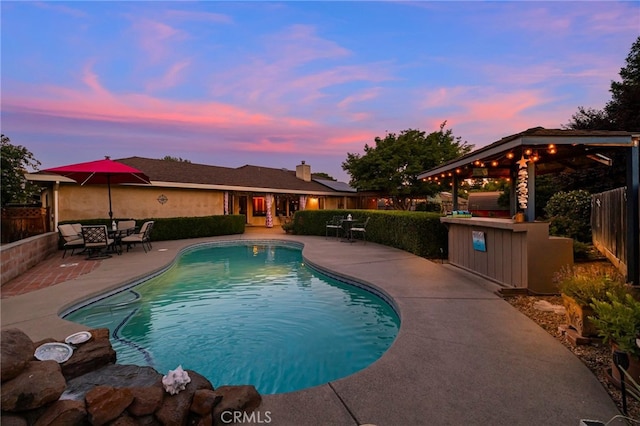 833 Saint Amant Dr, Chico, CA 95926 - pool at dusk with a patio and a fenced backyard