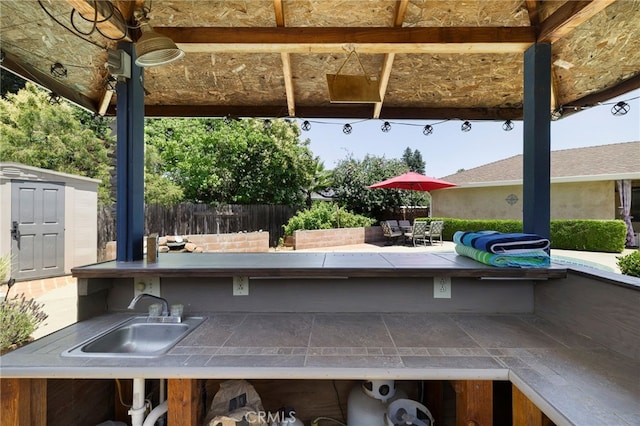 833 Saint Amant Dr, Chico, CA 95926 - view of patio / terrace featuring a storage unit, a bar, and outdoor dining space