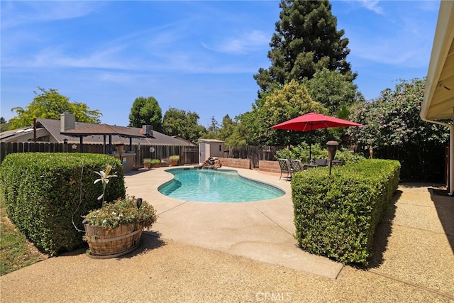 833 Saint Amant Dr, Chico, CA 95926 - view of pool featuring a patio area, a fenced backyard, and a storage unit