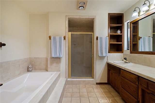 833 Saint Amant Dr, Chico, CA 95926 - bathroom with vanity, a garden tub, a stall shower, tile patterned flooring, and decorative backsplash