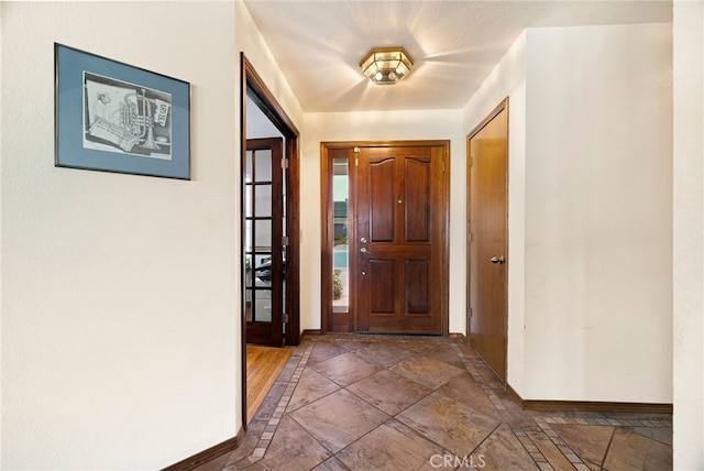 833 Saint Amant Dr, Chico, CA 95926 - foyer entrance featuring baseboards and stone tile flooring